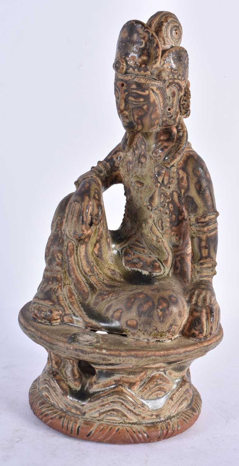 A RARE CHINESE QING DYNASTY CERAMIC POTTERY FIGURE OF A BUDDHA possibly Yue Ware. 21 cm high.