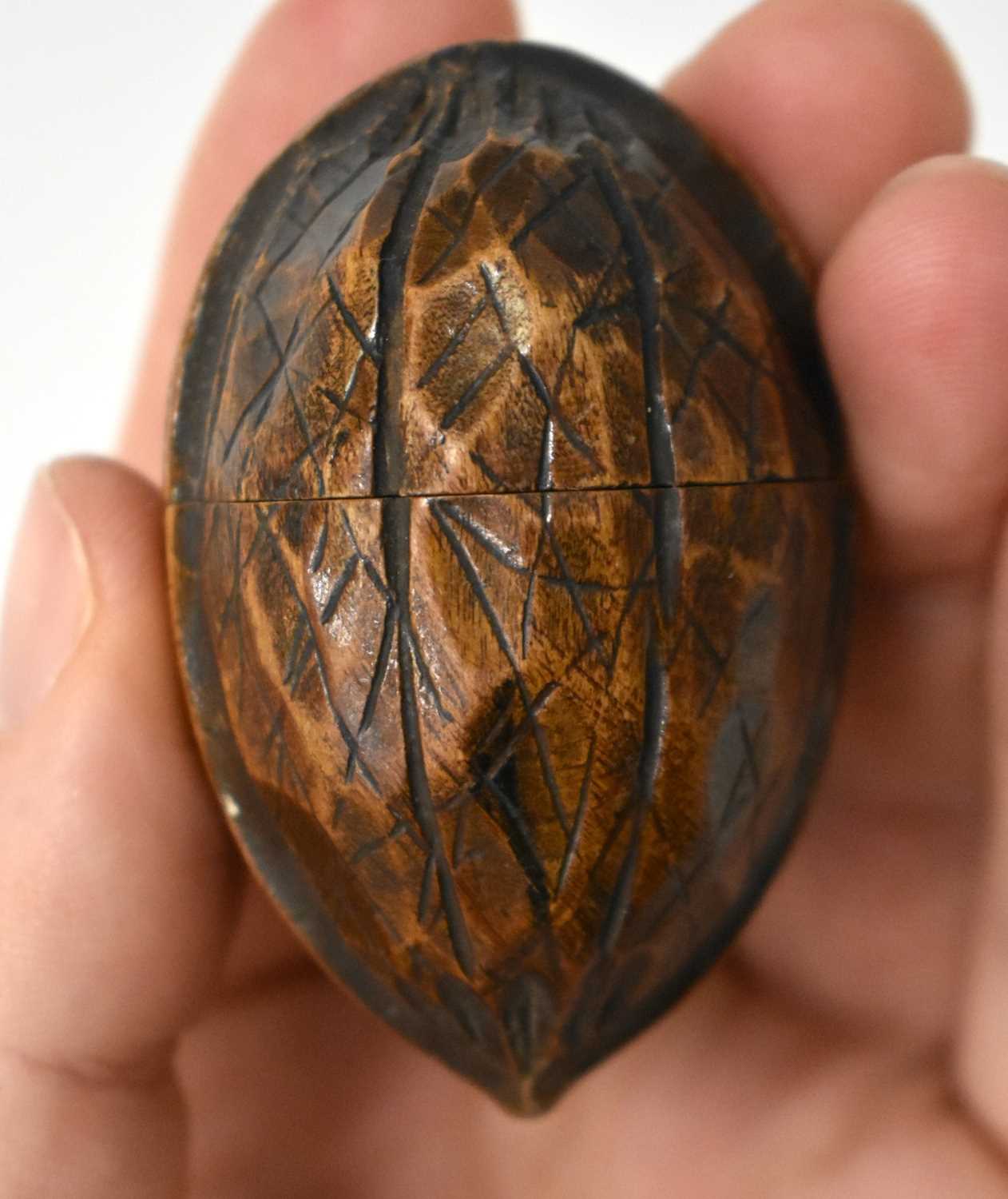 AN EXTREMELY RARE ANTIQUE CARVED NUT GLOBE the body rotating to reveal a tiny pocket globe. Nut 6 cm - Image 8 of 20