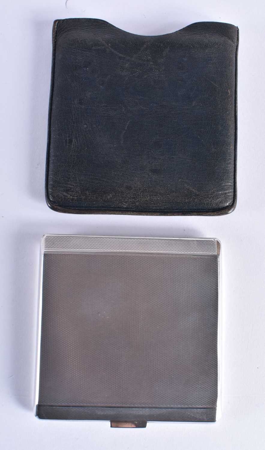 A Silver Cigarette Case with Engine Turned Decoration by HS Benzie, with fitted leather sleeve.