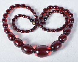 Cherry Bakelite graduated necklace with screw clasp. 72cm long, weight 51g, largest bead 20mm