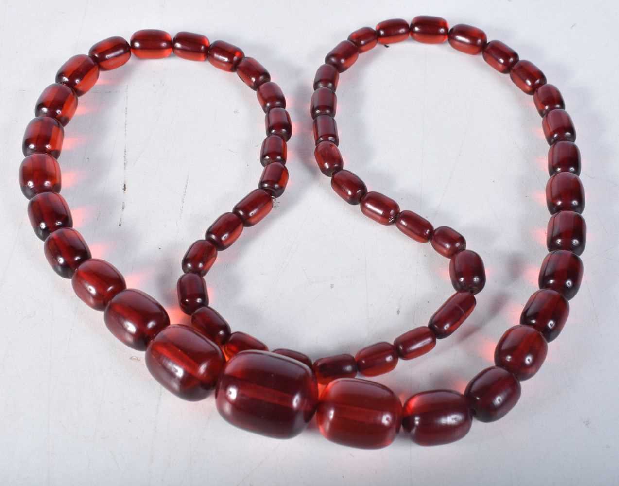 Cherry Bakelite graduated necklace. 88cm long, Largest Bead 22mm, weight 93g