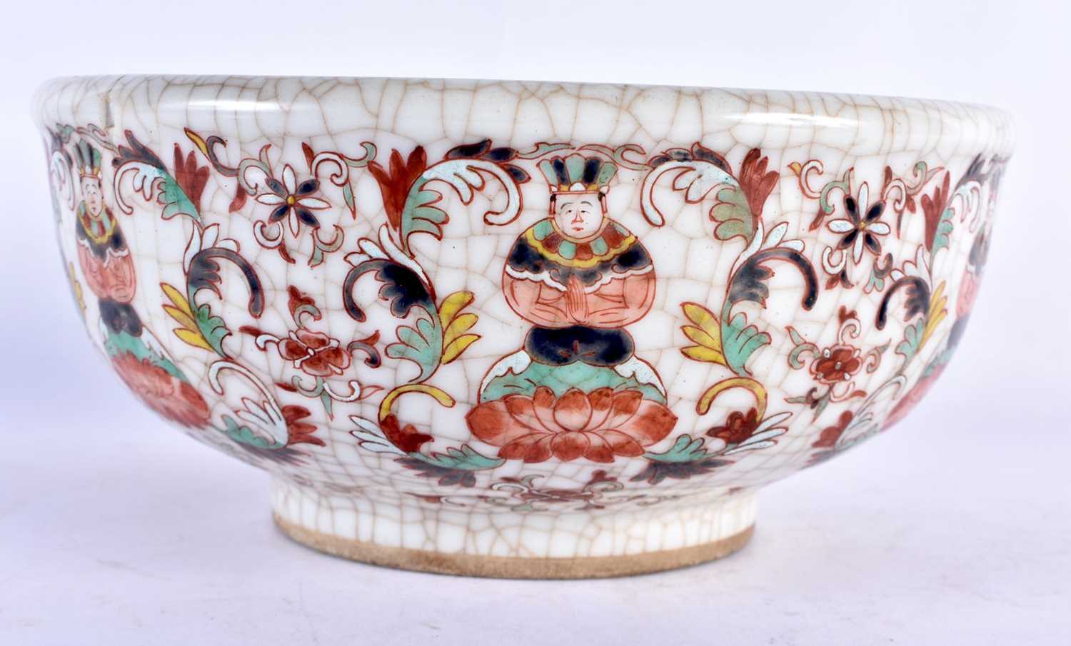 A CHINESE QING DYNASTY CRACKLED THAI MARKET BOWL painted with figures and foliage. 22 cm x 9 cm.