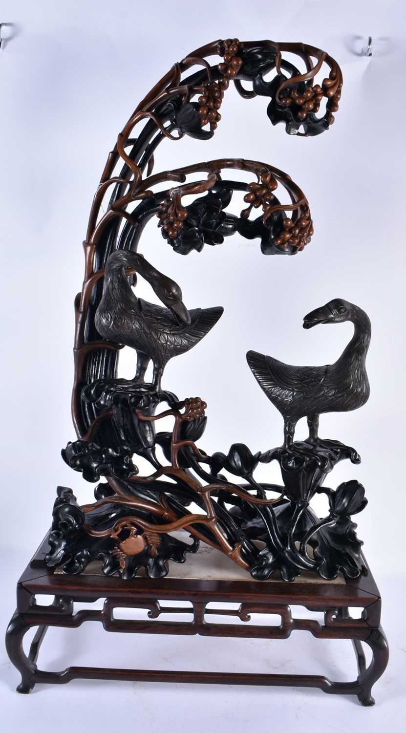 A RARE LARGE CHINESE QING DYNASTY BRONZE AND LACQUER STAND modelled as two birds, modelled upon a