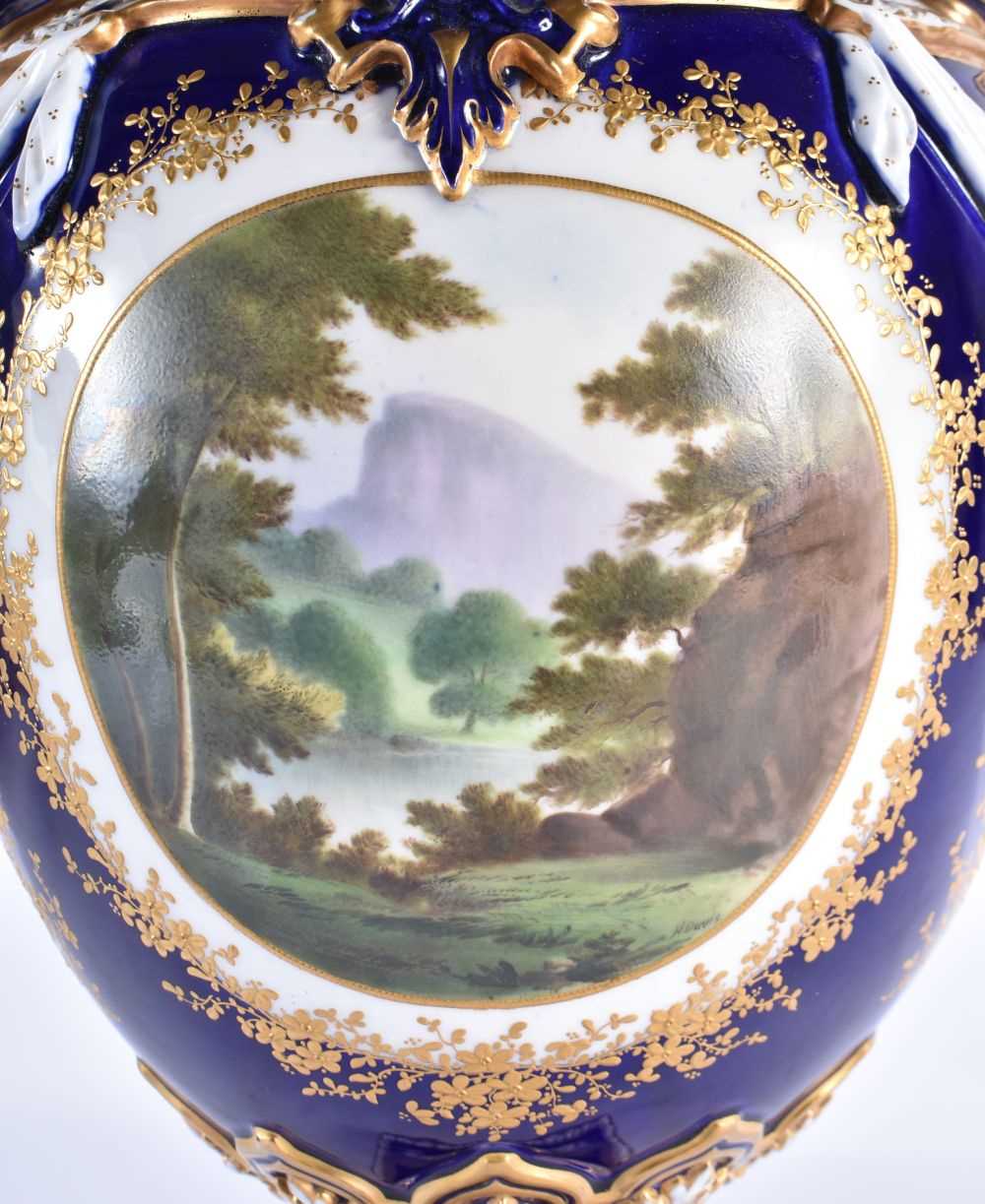 A FINE ROYAL WORCESTER TWIN HANDLED BLUE PORCELAIN VASE AND COVER painted with a landscape by - Image 6 of 9