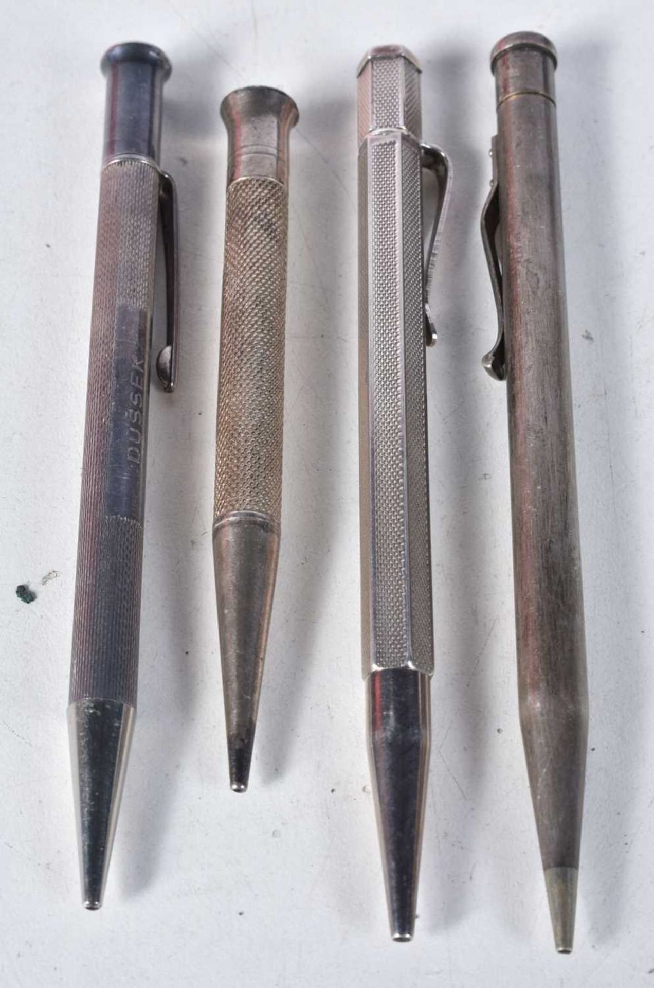 Four Silver Propelling Pencils. Various Birmingham Hallmarks. Largest 12.2cm x 0.9cm, total weight