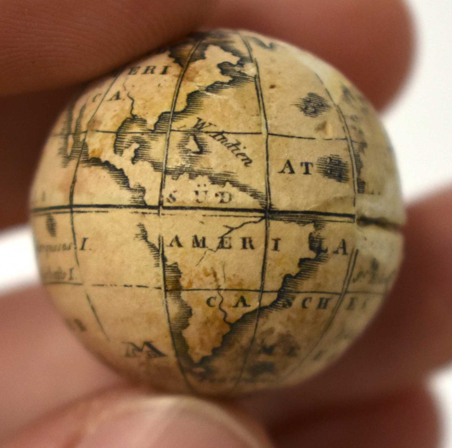 AN EXTREMELY RARE ANTIQUE CARVED NUT GLOBE the body rotating to reveal a tiny pocket globe. Nut 6 cm - Image 14 of 20