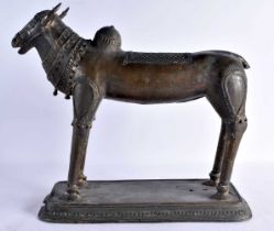 A LARGE DHOKRA BRONZE SCULPTURE OF A HOLY COW. Orissa (Odisha), Eastern India, 18th - 19th