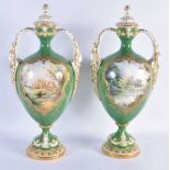 A FINE PAIR OF ROYAL WORCESTER TWIN HANDLED WORCESTER VASES AND COVERS by Harry Davis, painted