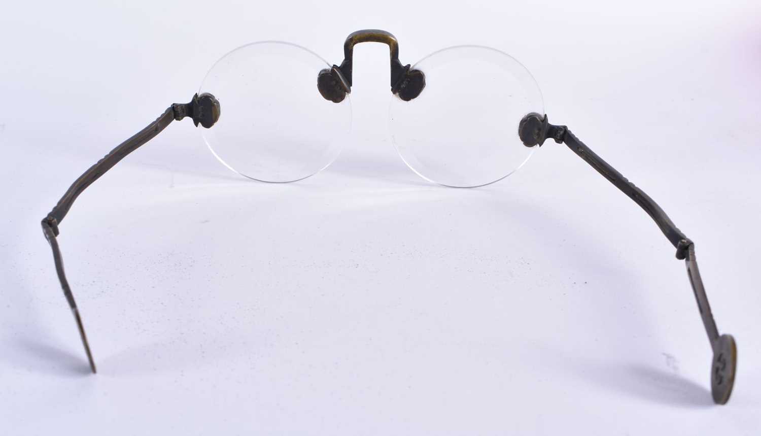 A RARE PAIR OF CHINESE QING DYNASTY BRONZE SPECTACLES. 15 cm wide. - Image 3 of 3