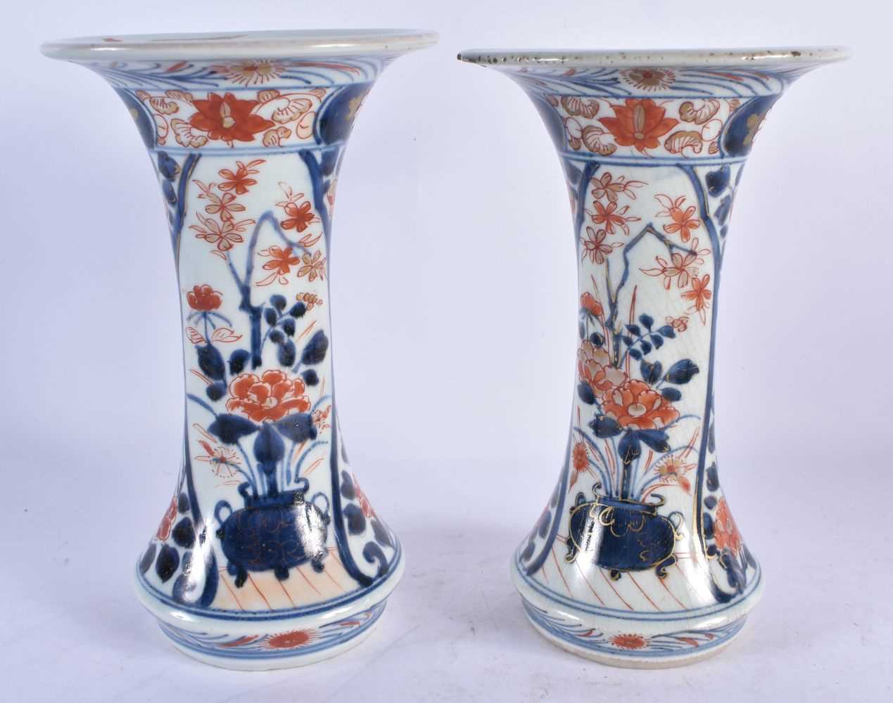 AN 18TH CENTURY JAPANESE EDO PERIOD IMARI PORCELAIN GARNITURE OF VASES painted with flowers. Largest - Image 6 of 8