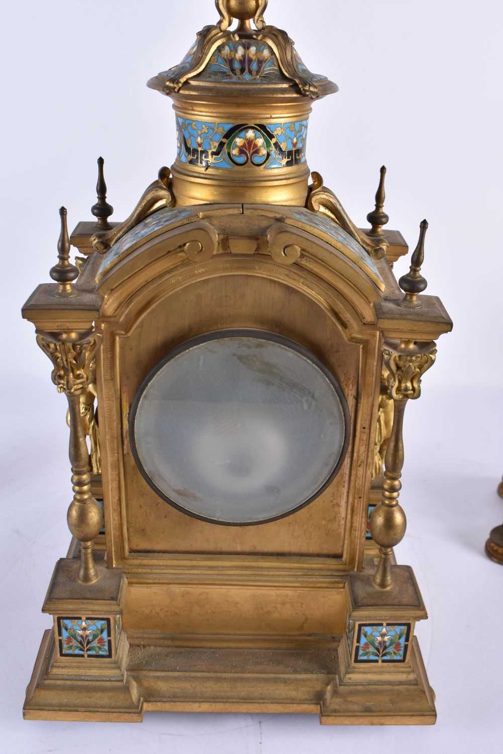 A FINE 19TH CENTURY FRENCH ORMOLU AND CHAMPLEVE ENAMEL CLOCK GARNITURE formed with putti amongst - Image 8 of 9