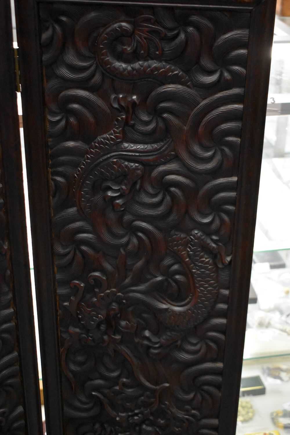 A LARGE 19TH CENTURY CHINESE CARVED HARDWOOD FOUR FOLD DRAGON SCREEN Qing. 142 cm x 136 cm. - Image 10 of 13