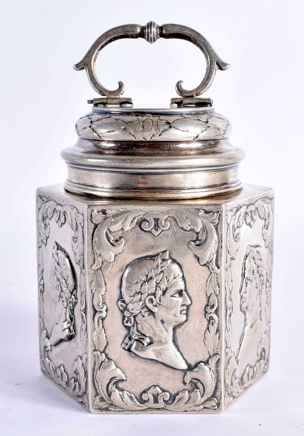 AN 18TH CENTURY CONTINENTAL SILVER TEA CADDY AND COVER decorated with classical mask heads, under