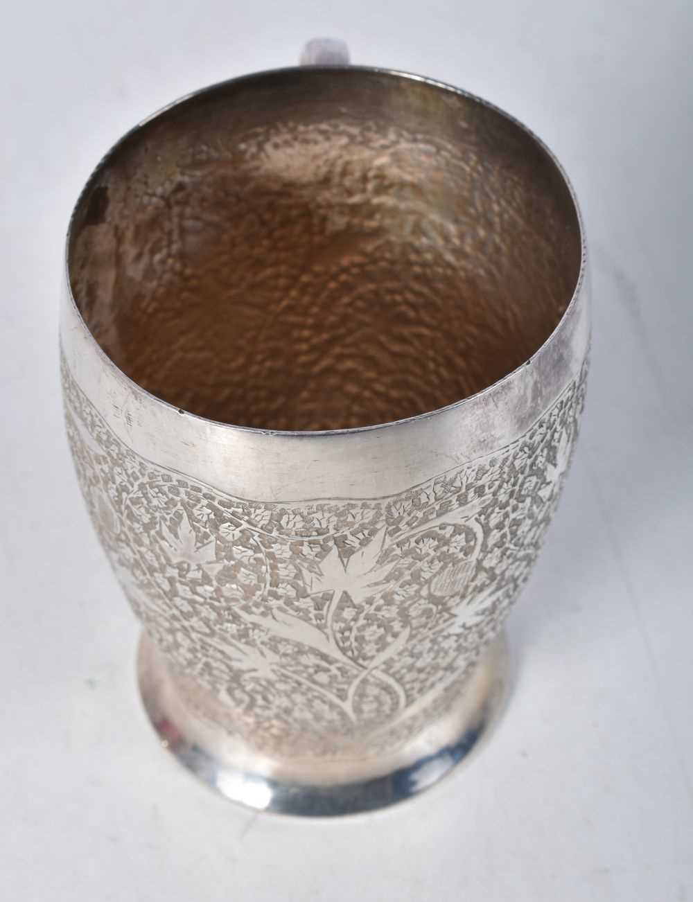 A White Metal Cup with Embossed Floral decoration. 8.3cm x 8.4cm x 6.4cm, weight 121g - Image 2 of 3