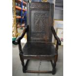 AN 18TH CENTURY ENGLISH COUNTRY CHAIR with carved stylised backsplat. 123 cm x 57 cm.