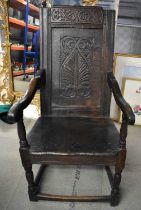 AN 18TH CENTURY ENGLISH COUNTRY CHAIR with carved stylised backsplat. 123 cm x 57 cm.