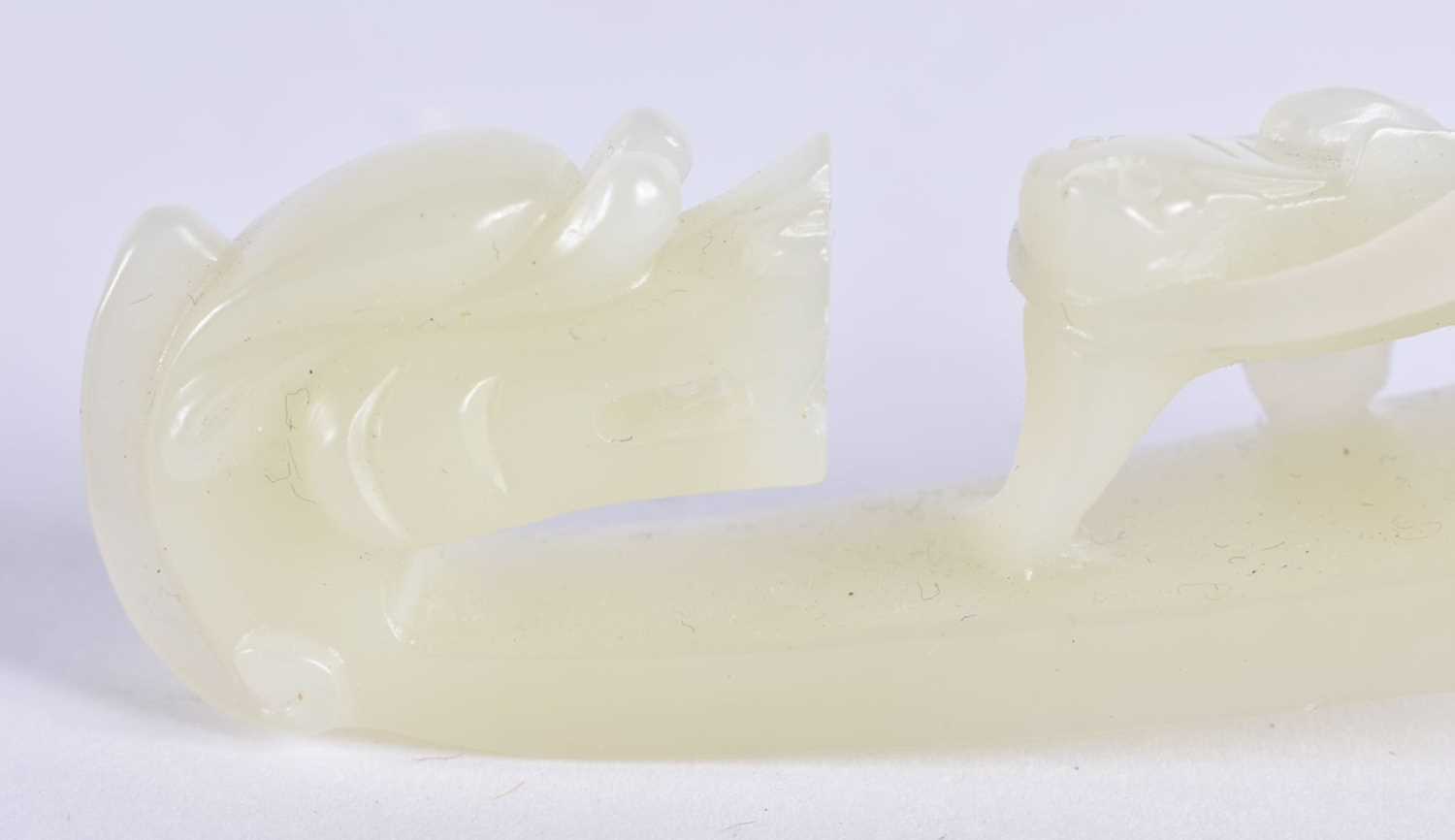 A FINE PAIR OF CHINESE QING DYNASTY CARVED GREENISH WHITE JADE BELT HOOKS Qing, formed as stylised - Image 6 of 30