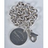 Silver bracelet with heart tag by designer Tiffany & Co. Stamped Tiffany 925. 18cm long, weight 35g