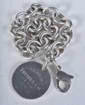 Silver bracelet with heart tag by designer Tiffany & Co. Stamped Tiffany 925. 18cm long, weight 35g