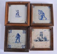 FOUR WOOD FRAMED DELFT BLUE AND WHITE TILES. 15 cm square. (4)