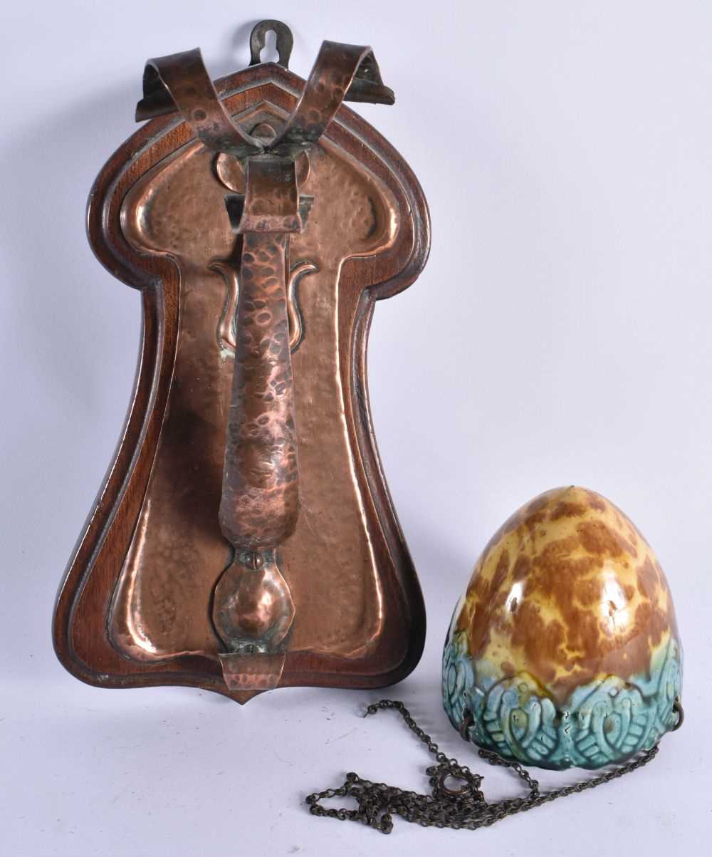 AN ARTS AND CRAFTS COPPER WALL HANGING with hanging pottery bowl. Copper part 28 cm x 14 cm. (2)