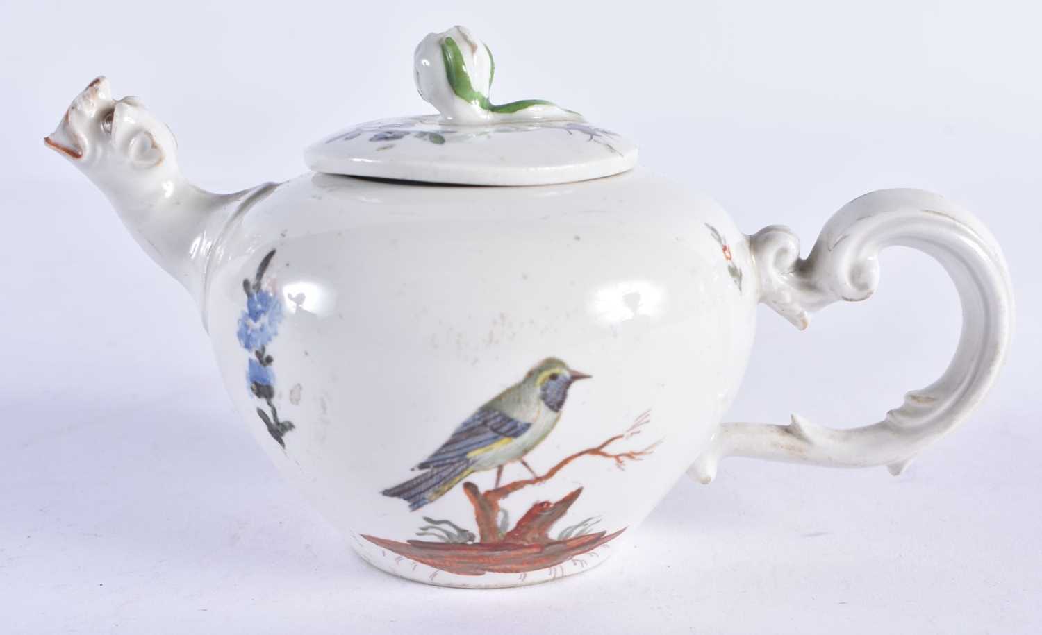 A RARE 18TH CENTURY GERMAN PORCELAIN BULLET FORM TEAPOT AND COVER painted in the Meissen style