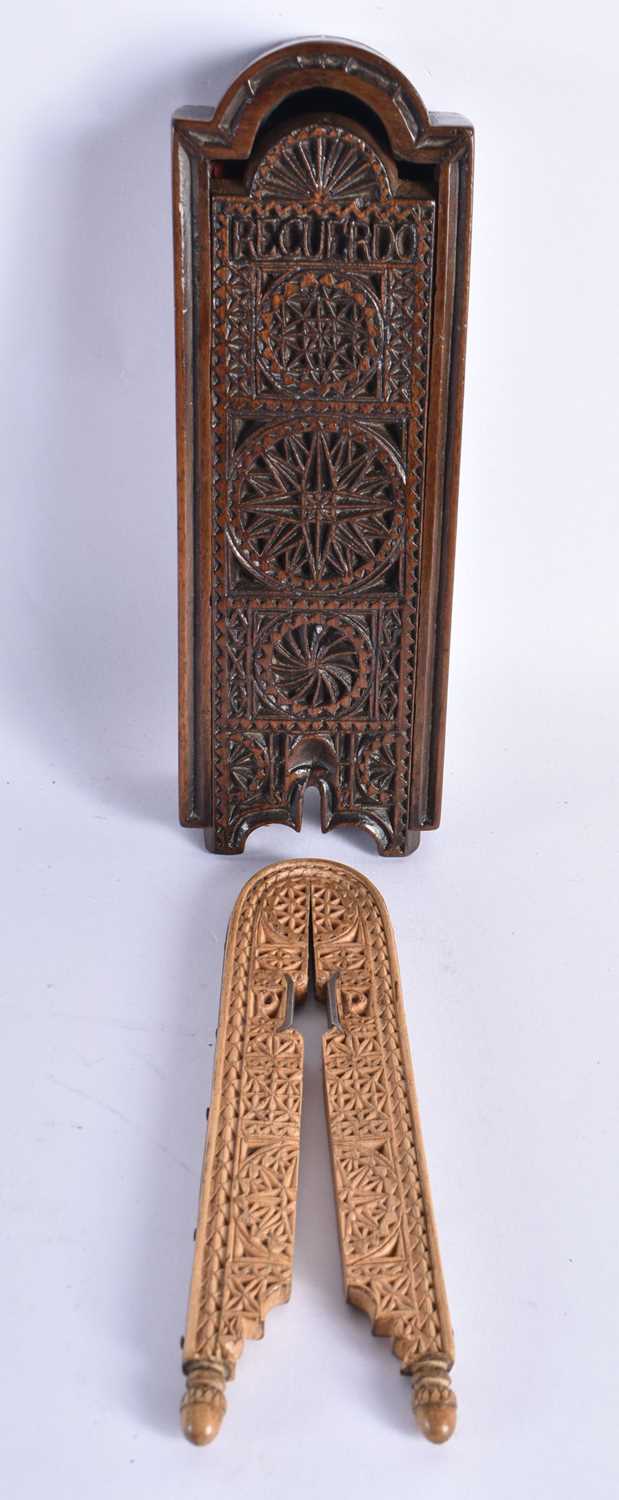 AN UNUSUAL CASED PAIR OF EARLY 19TH CENTURY TREEN NUT CRACKERS decorated with sunburst motifs, the