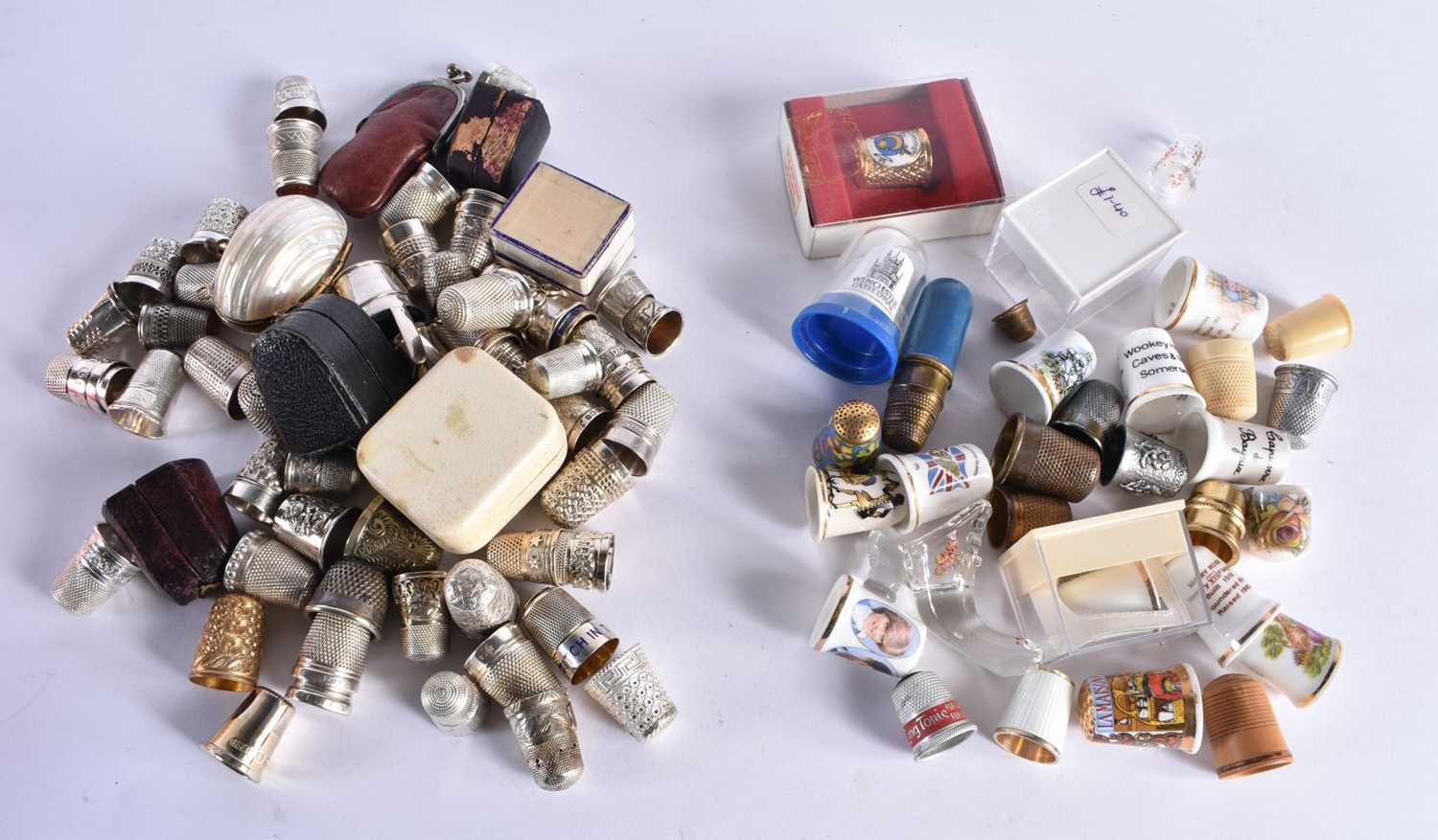 A Large Collection of Thimbles containing 77 Silver with various marks and 30 others. Largest 4.