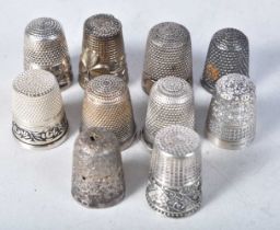 A Silver Charles Horner Thimble together with Nine others. Various Hallmarks. Largest 2.3cm x 1.8cm,