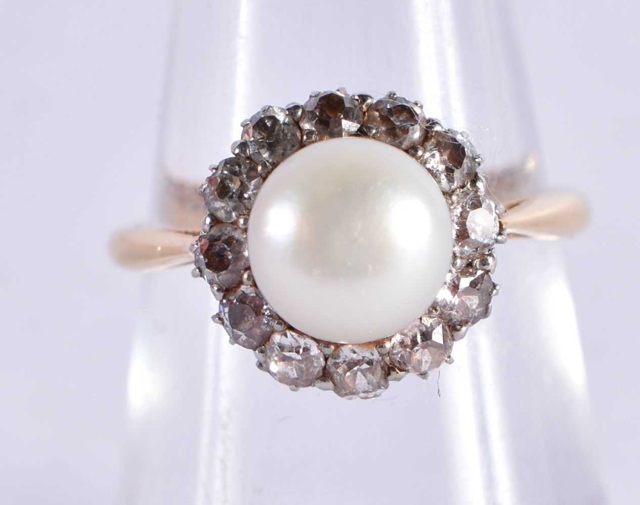 AN EDWARDIAN 18CT GOLD DIAMOND AND PEARL RING. 4 grams. N.
