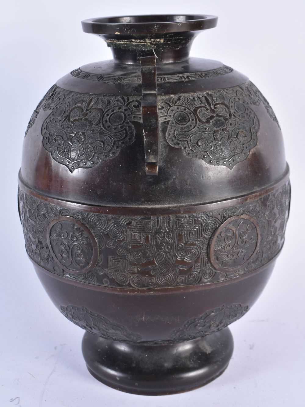 A LARGE 19TH CENTURY JAPANESE MEIJI PERIOD BRONZE VASE decorated with archaic motifs and foliage. 30 - Image 4 of 8