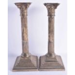 A LARGE PAIR OF ANTIQUE SILVER CORINTHIAN COLUMN CANDLESTICKS. Birmingham 1919. 31 cm x 12.5 cm.