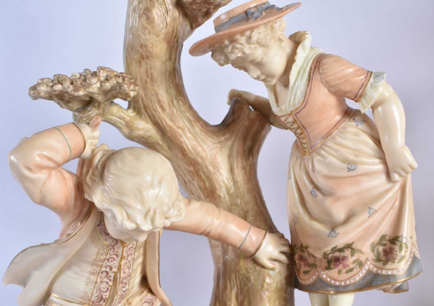 A RARE PAIR OF ROYAL WORCESTER HADLEYS BLUSH IVORY FIGURAL CANDLESTICKS modelled as children upon - Image 2 of 8