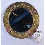 A LARGE ARTS AND CRAFTS COPPER AND BRASS REPOSSE MIRROR. 40 cm diameter.