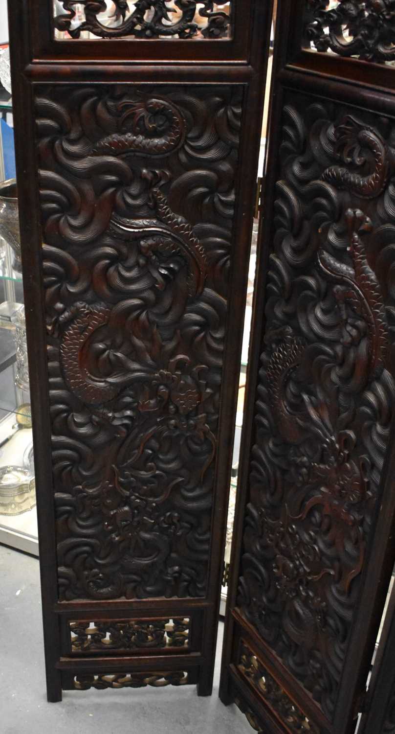 A LARGE 19TH CENTURY CHINESE CARVED HARDWOOD FOUR FOLD DRAGON SCREEN Qing. 142 cm x 136 cm. - Image 4 of 13