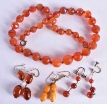 THREE PAIRS OF ANTIQUE AMBER EARRINGS together with a necklace. 73 grams. Largest 46 cm long. (7)