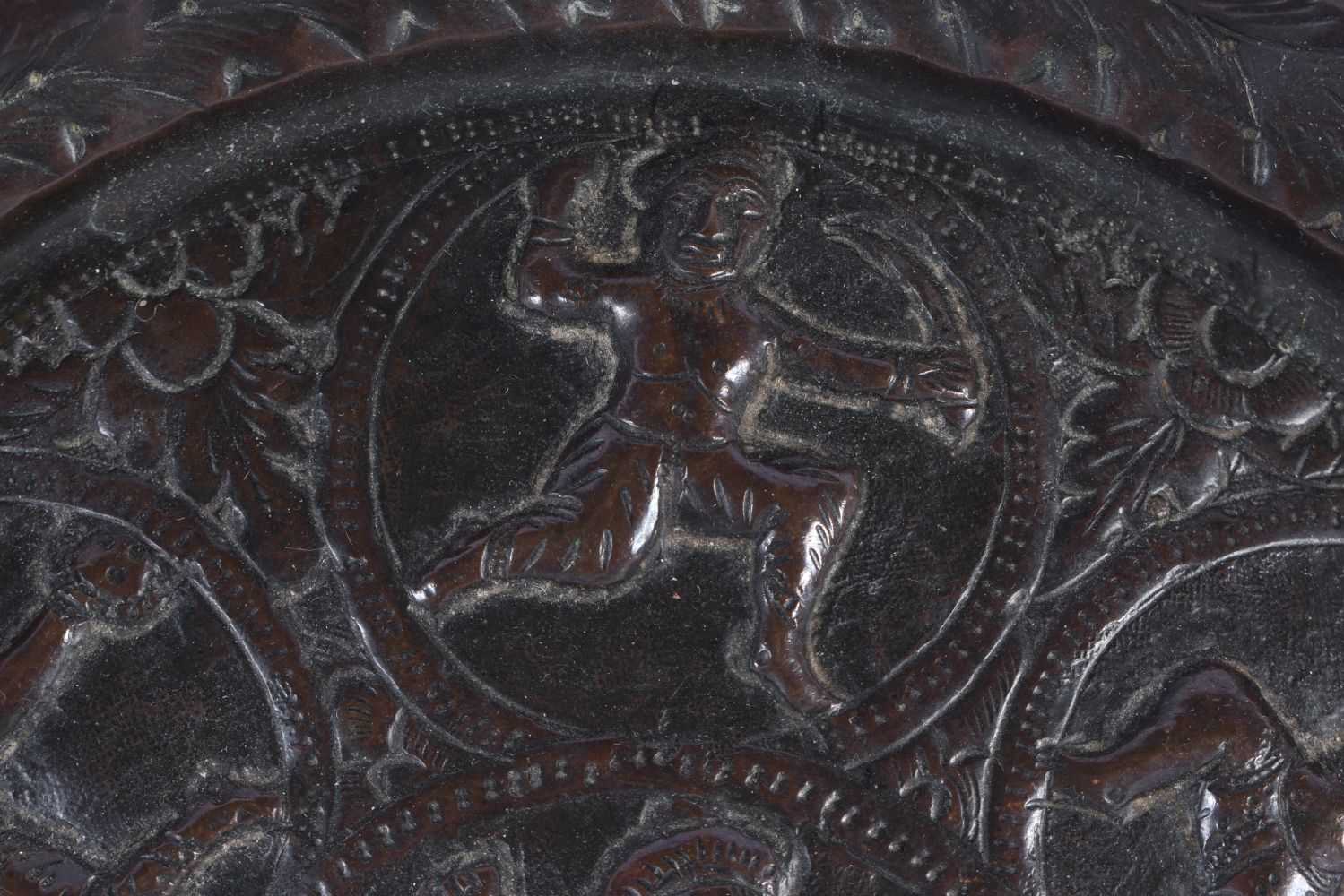 A 19TH CENTURY INDIAN BRONZE REPOUSSE DEITY DISH decorated with figures. 21 cm diameter. - Image 2 of 5