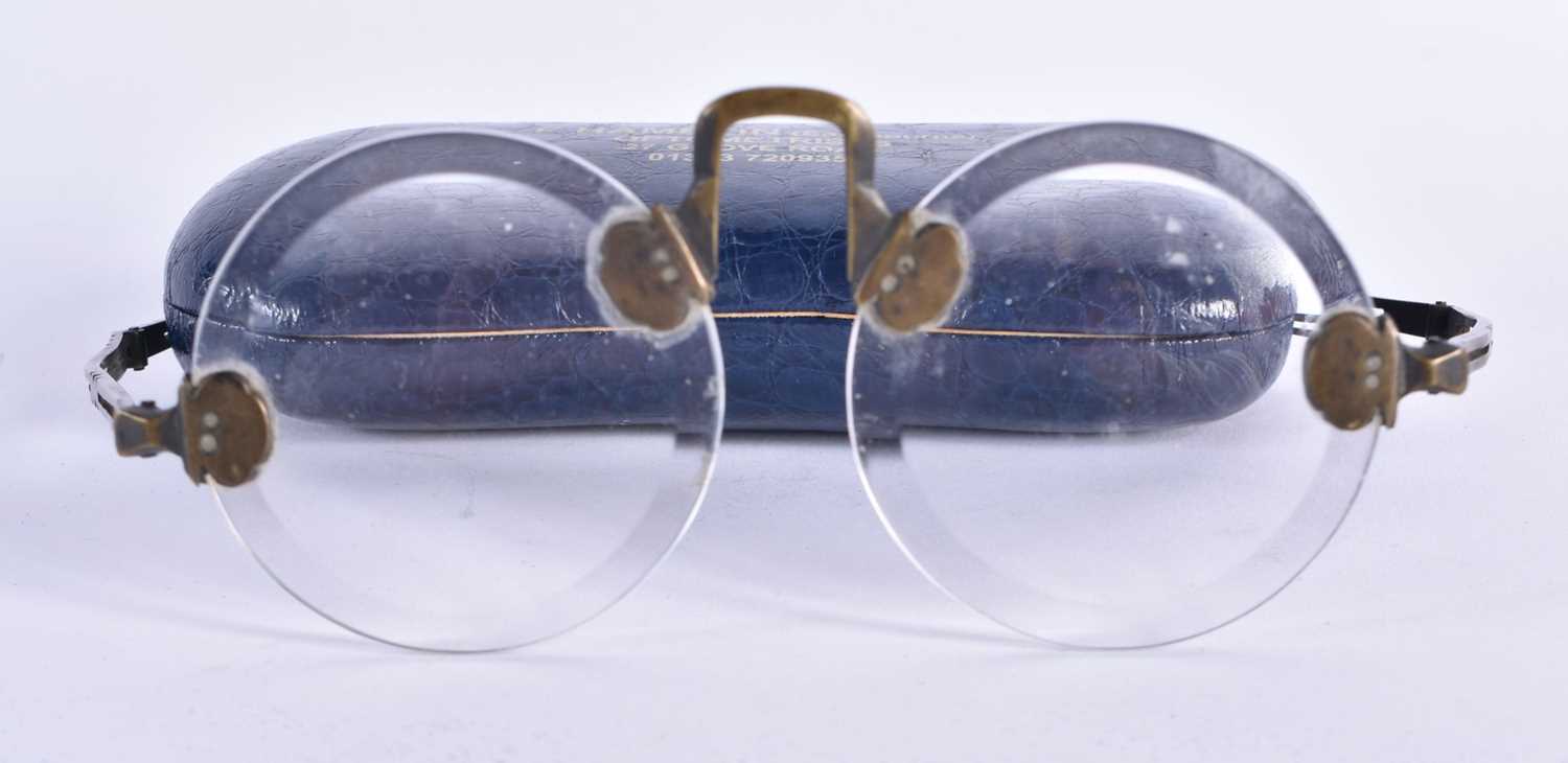 A RARE PAIR OF CHINESE QING DYNASTY BRONZE SPECTACLES. 15 cm wide.