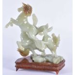AN EARLY 20TH CENTURY CHINSE CARVED JADE FIGURE OF FOUR HORSES Late Qing/Republic. 18 cm x 12 cm.
