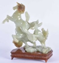 AN EARLY 20TH CENTURY CHINSE CARVED JADE FIGURE OF FOUR HORSES Late Qing/Republic. 18 cm x 12 cm.