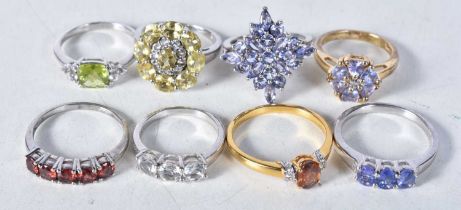 A collection of silver gemstone rings including Tanzanite. Stamped 925. Sizes L-U, total weight