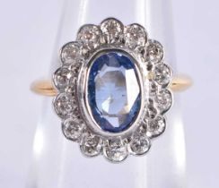 AN EDWARDIAN 18CT GOLD DIAMOND AND PALE SAPPHIRE RING. K. 4.6 grams.