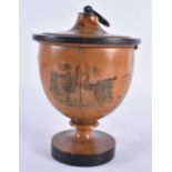 AN EARLY 19TH CENTURY CONTINENTAL CARVED WOOD TEA CADDY AND COVER decorated with prints of