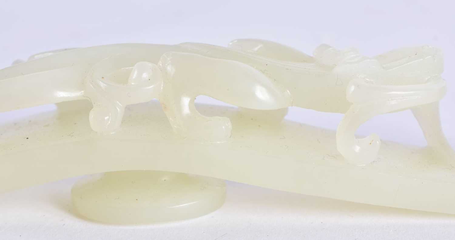 A FINE PAIR OF CHINESE QING DYNASTY CARVED GREENISH WHITE JADE BELT HOOKS Qing, formed as stylised - Image 3 of 30