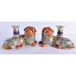 A PAIR OF EARLY 19TH CENTURY CHINESE CANTON FAMILLE ROSE JOSS STICK HOLDERS Qing, modelled as