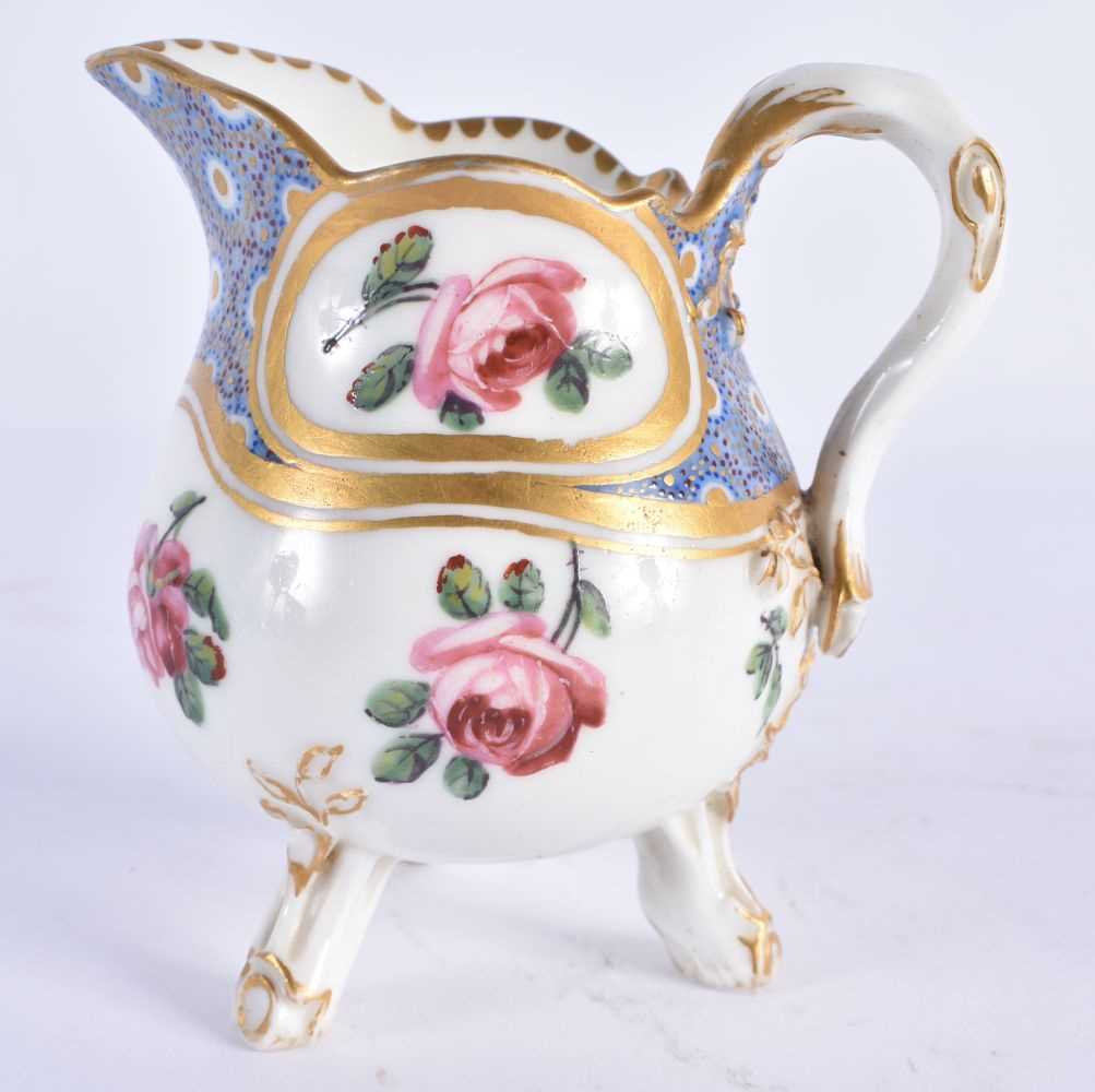AN 18TH CENTURY FRENCH SEVRES PORCELAIN CREAM JUG painted with flowers. 9 cm x 8 cm.