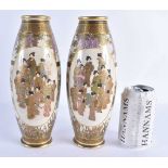 A PAIR OF LATE 19TH CENTURY JAPANESE MEIJI PERIOD SATSUMA POTTERY VASES painted with a group of