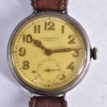 A J W BENSON SILVER TRENCH STYLE WRISTWATCH. 3.75 cm wide inc crown.