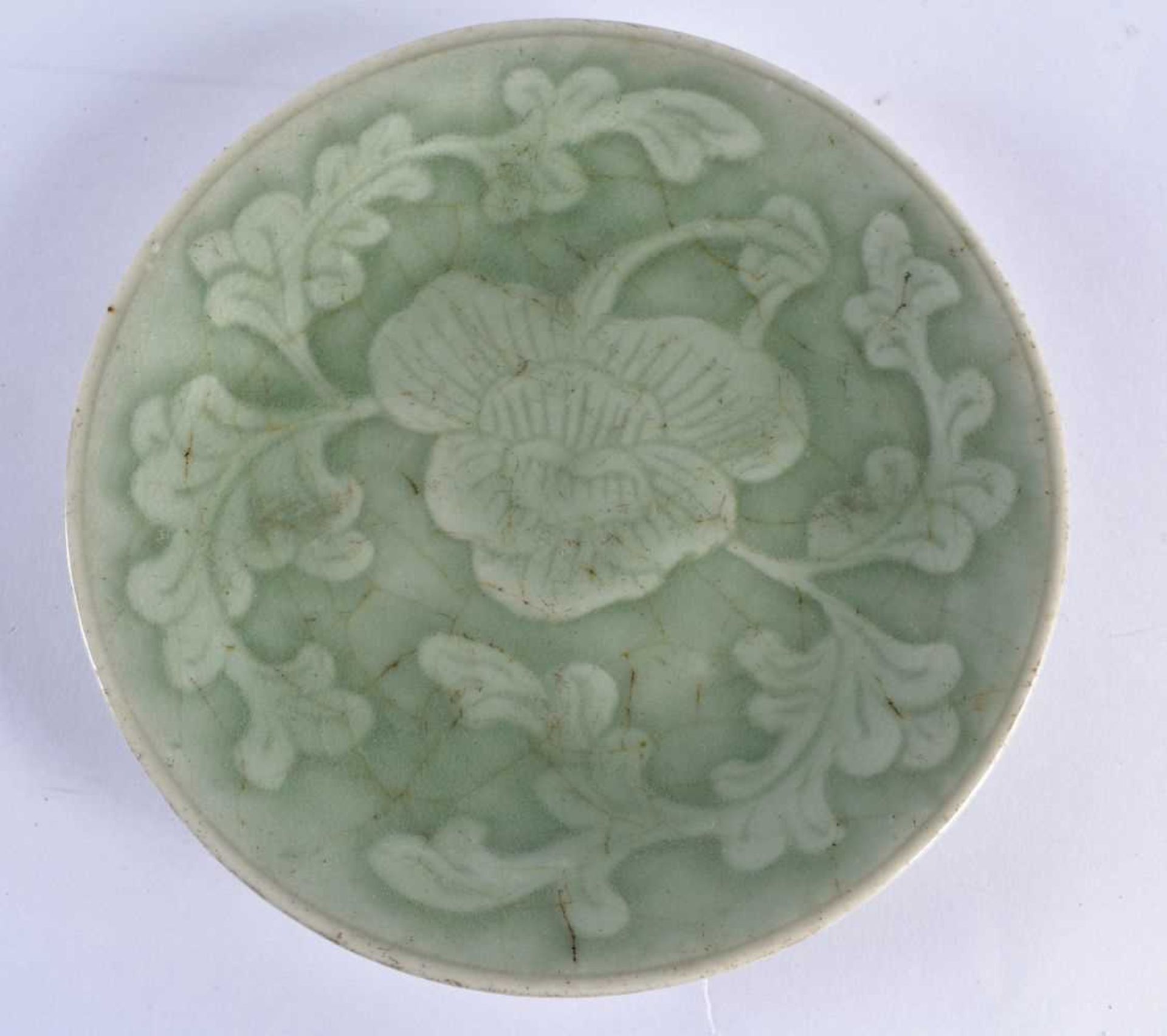A 17TH/18TH CENTURY CHINESE LONGQUAN CELADON MOULDED DISH Late Ming. 14.5 cm diameter.