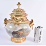 A FINE ROYAL WORCESTER TWIN HANDLED PORCELAIN POT POURRI AND COVER by John Stinton, painted with two